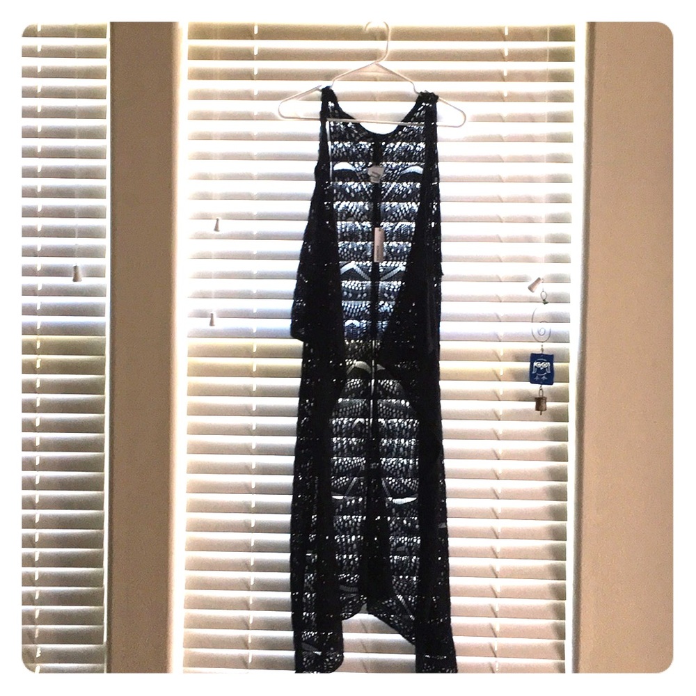 Knit sleeveless cover up.